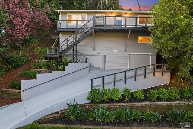 a view of a patio with a table and chairs and wooden floor