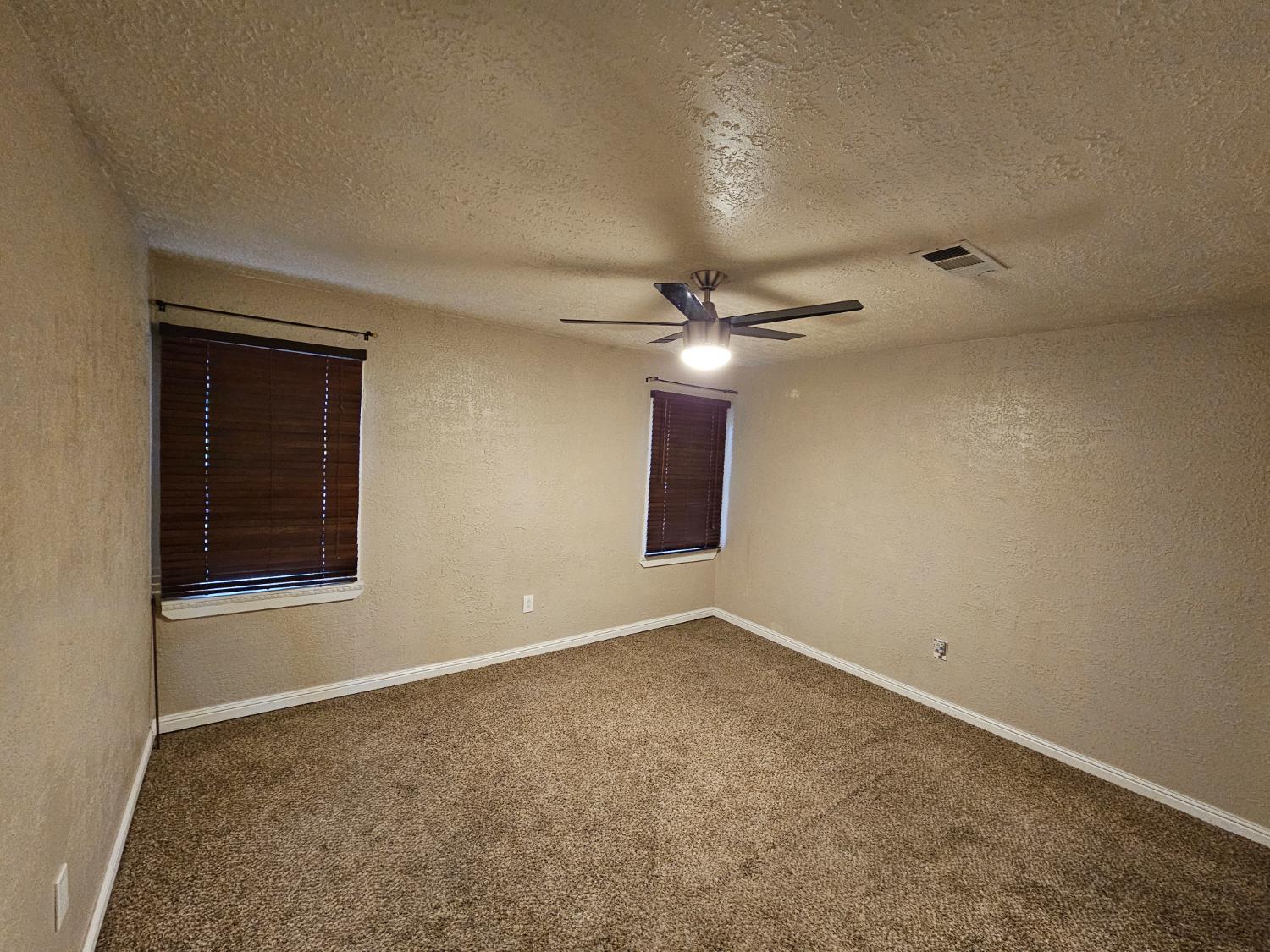 1140 Locust Street Gridley, CA 95948 - Photo 11 of 22 a view of an empty room with a window