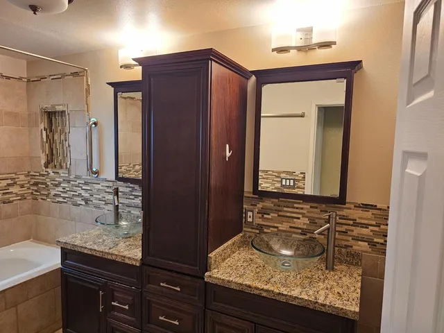 a bathroom with a bathtub and a shower