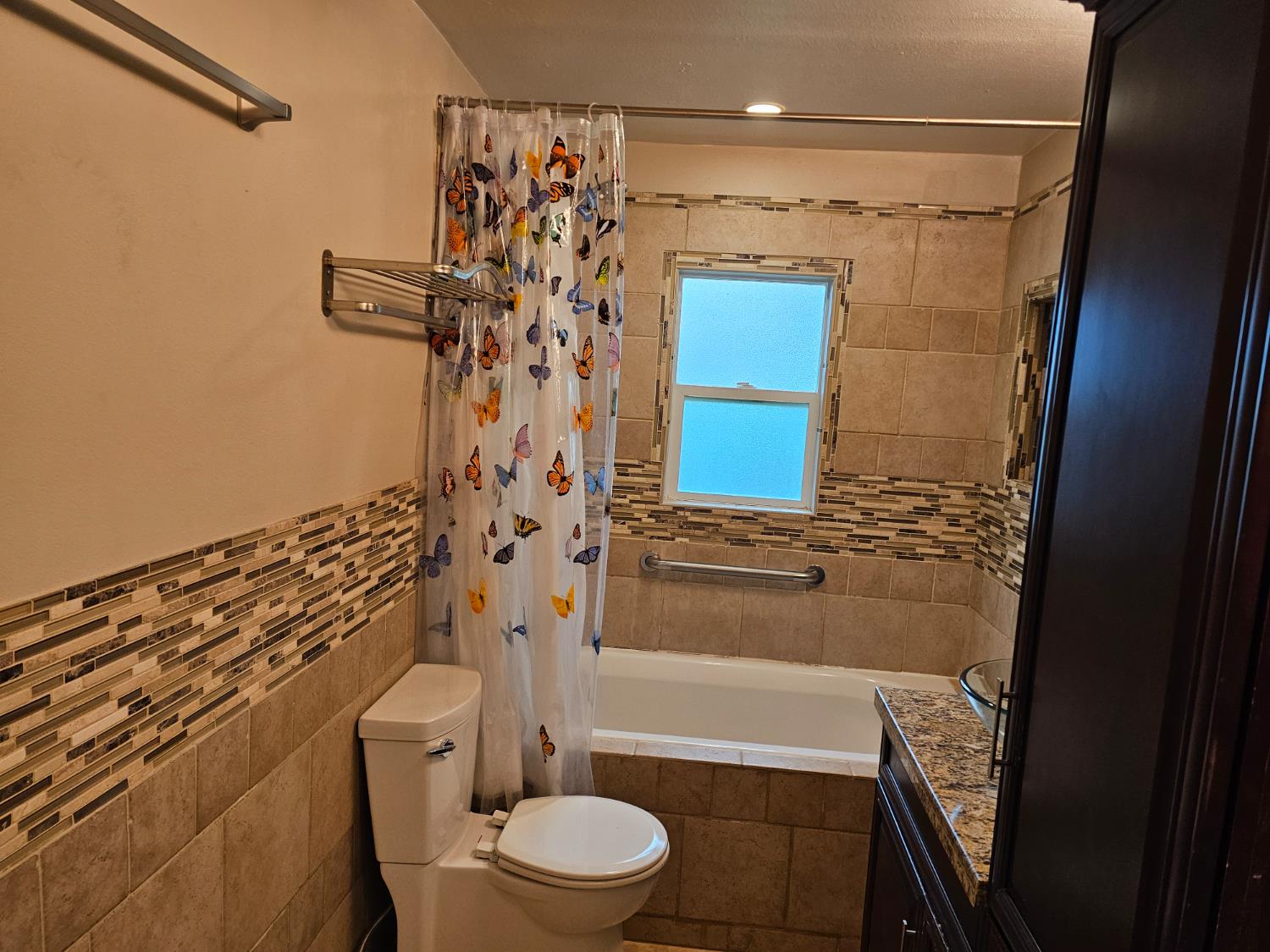 1140 Locust Street Gridley, CA 95948 - Photo 18 of 22 a bathroom with a toilet and shower