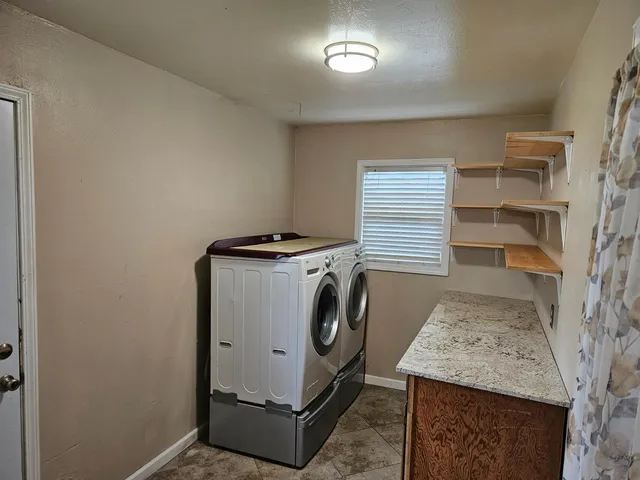 a utility room with dryer and washer