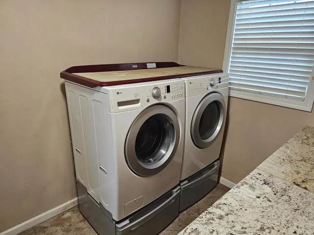 a utility room with dryer and washer