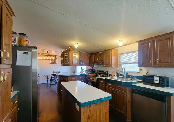 a kitchen with lots of counter top space and center island