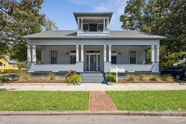a view of house with a swimming pool