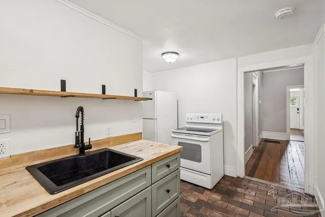 a kitchen with a sink and a stove
