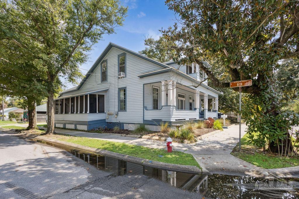 600 East Jackson Street Pensacola, FL 32501 - Photo 2 of 45 a view of a house with swimming pool and sitting area