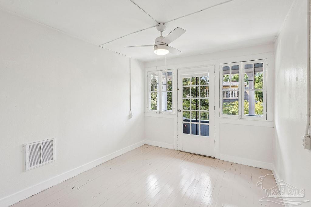 600 East Jackson Street Pensacola, FL 32501 - Photo 21 of 45 a view of an empty room with a window