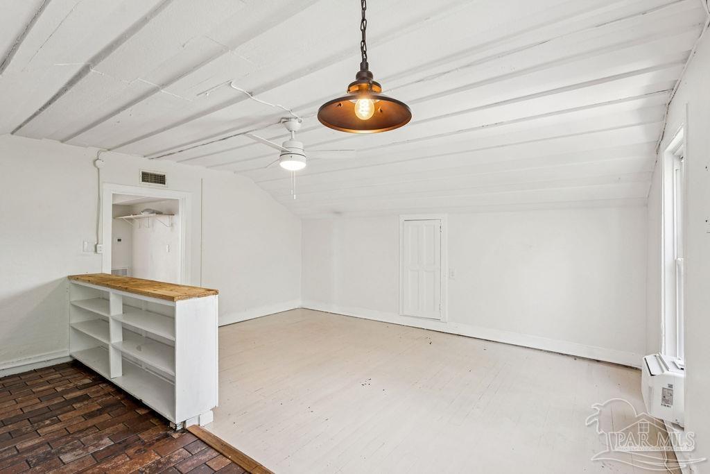 600 East Jackson Street Pensacola, FL 32501 - Photo 26 of 45 a room with a stove and cabinets