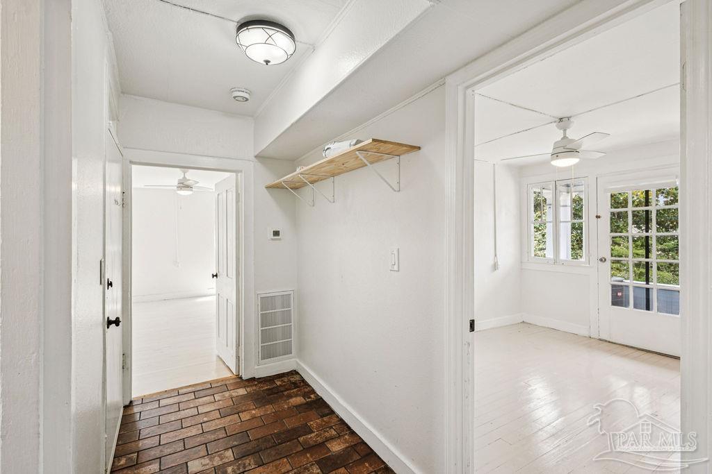600 East Jackson Street Pensacola, FL 32501 - Photo 27 of 45 a view of livingroom with hardwood floor and window