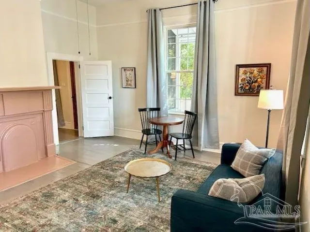 a living room with furniture and a table