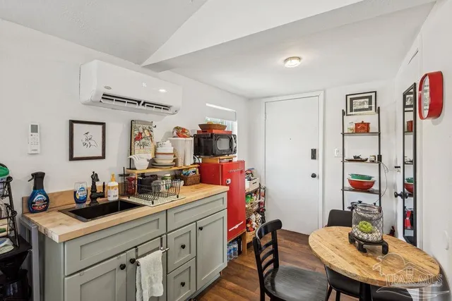 a kitchen that has a sink and a stove in it