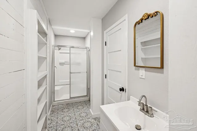 a bathroom with a sink and a mirror