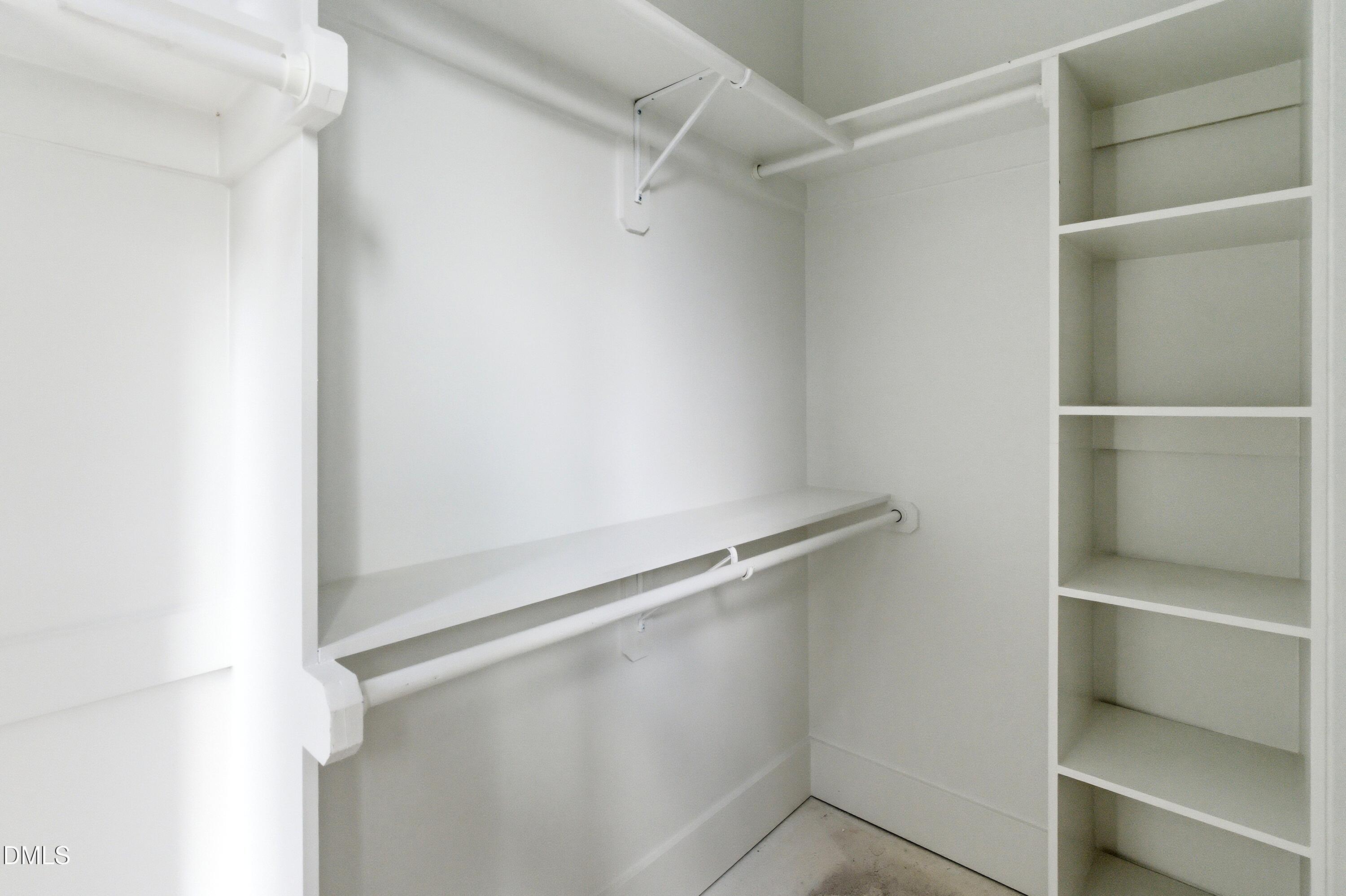 720 Noble Town Way, Unit 104 Raleigh, NC 27603 - Photo 14 of 21 Each bedroom suite comes with a spacious walk-in closet with custom built-ins and shelving