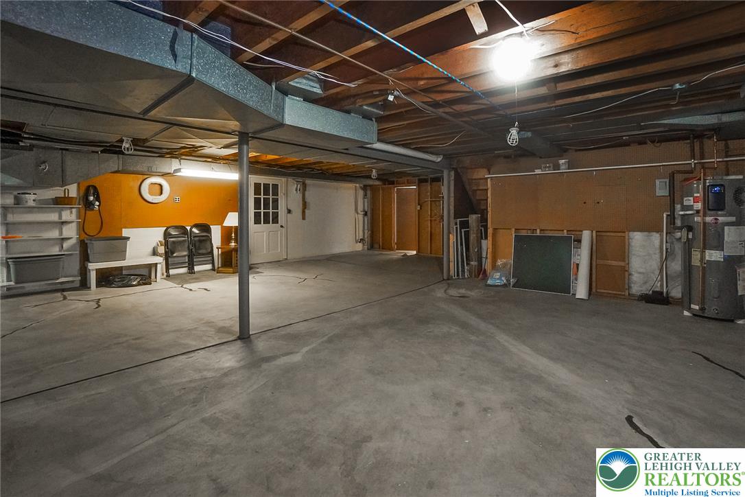 525 Wedgewood Road Bethlehem, PA 18017 - Photo 46 of 61 A spacious, unfinished basement offers ample bilk door for easy outdoor access.