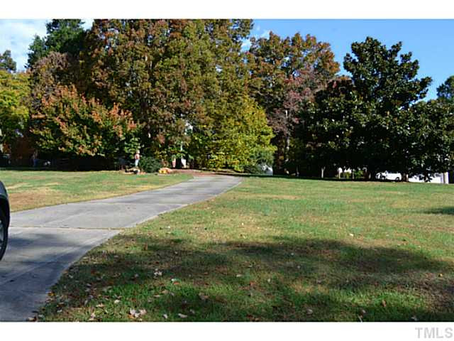 9936 Baileywick Road Raleigh, NC 27613 - Photo 3 of 24 a view of a field with trees