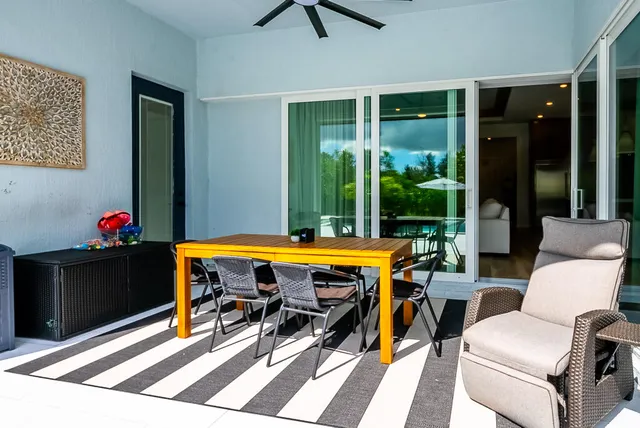 a view of a backyard with sitting area