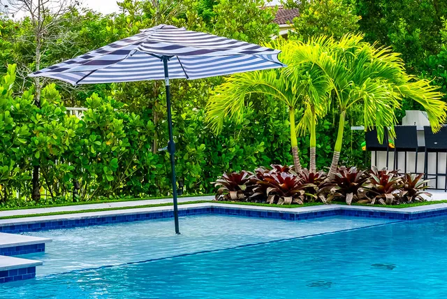 a balcony with table and chairs