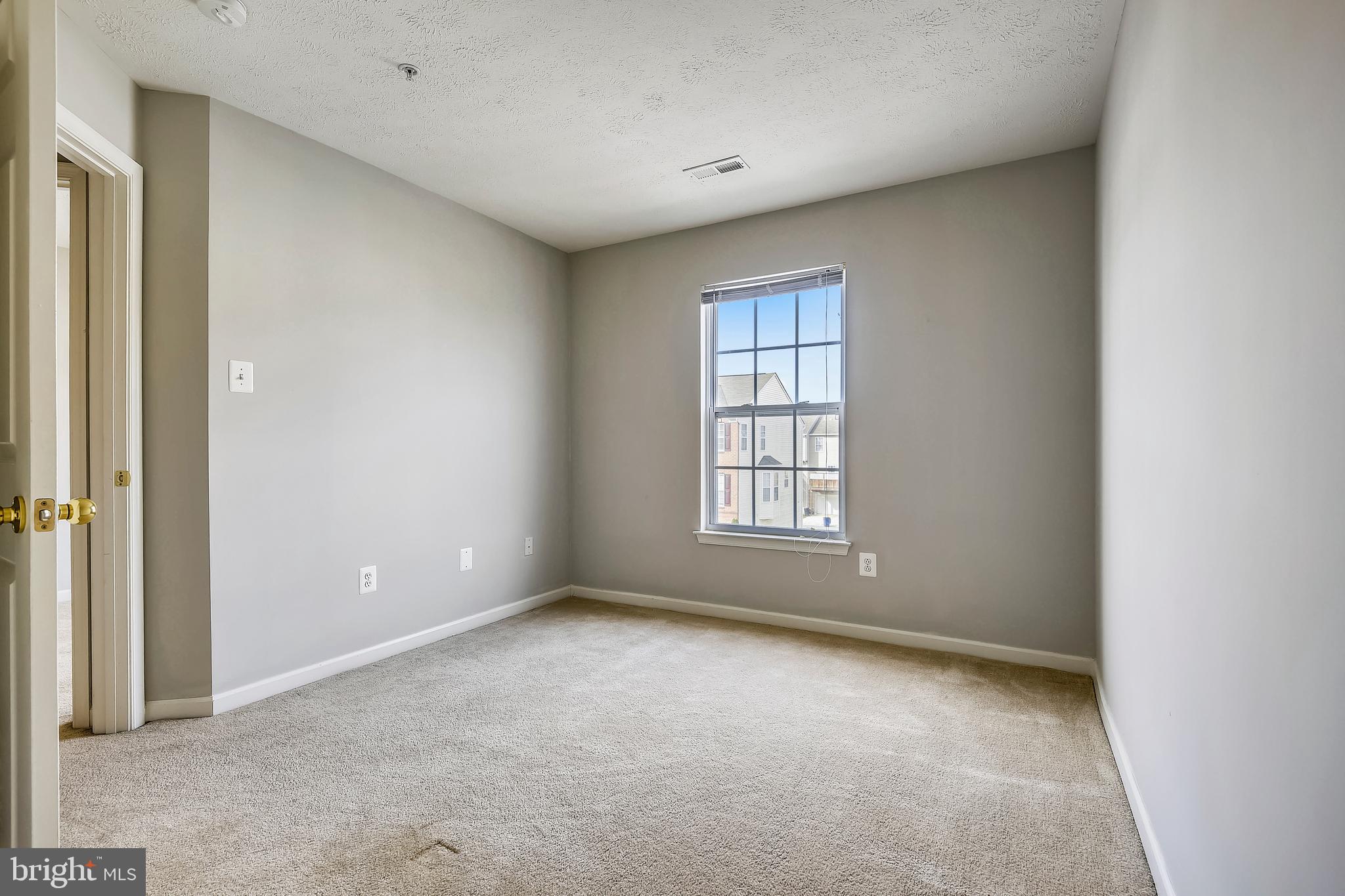 9820 Biggs Road Middle River, MD 21220 - Photo 25 of 35 an empty room with a empty space and windows