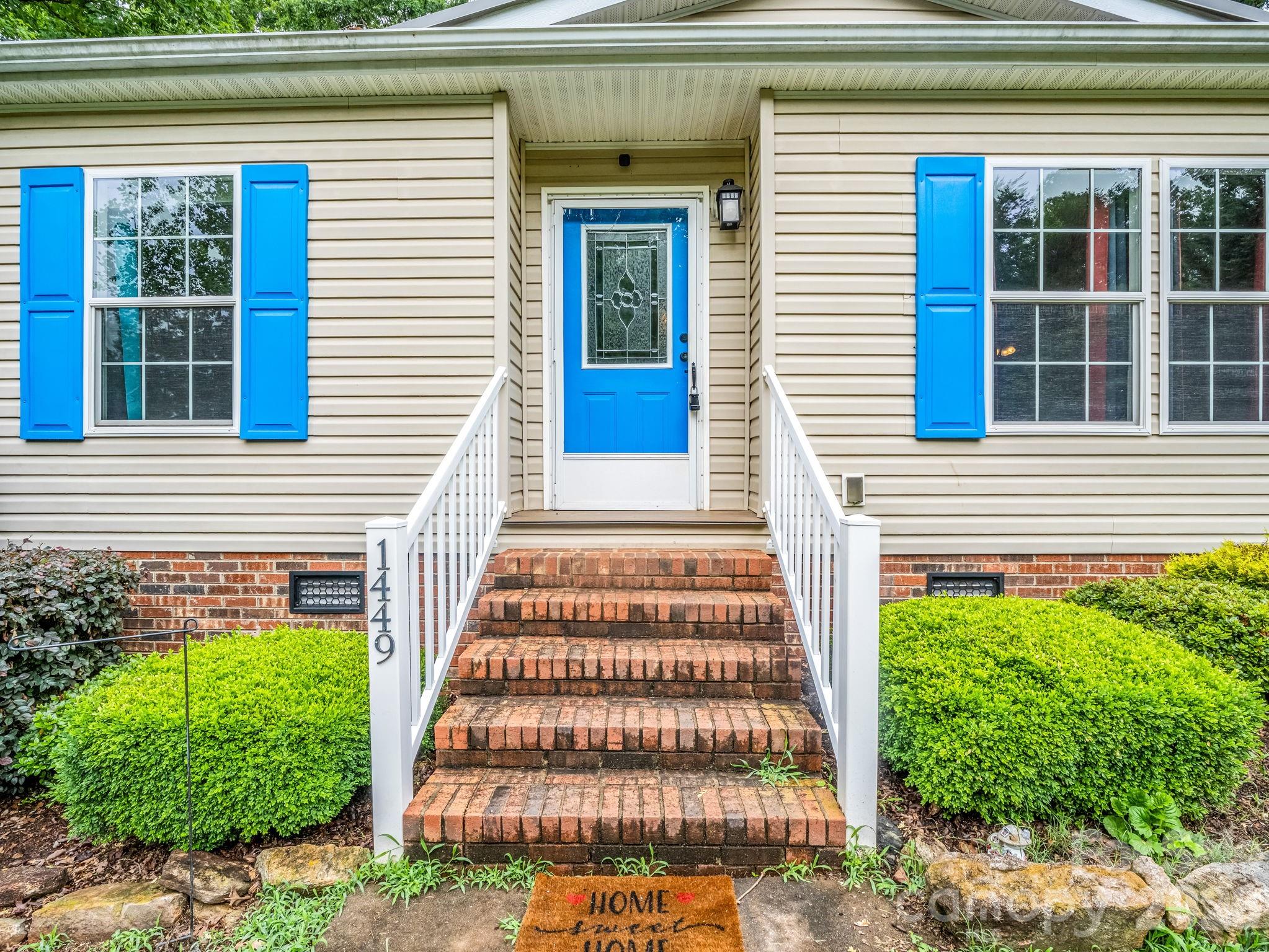 1449 Toney Road Bostic, NC 28018 - Photo 14 of 43 a front view of a house with a yard