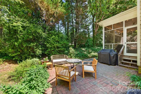 a view of a patio with a table and chairs