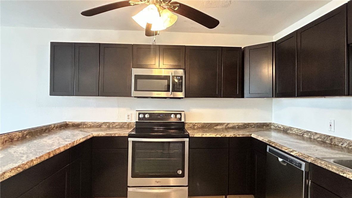 1004 Austin Street, Unit 9 Portland, TX 78374 - Photo 7 of 22 Stocked with stainless steel appliances of oven/ra