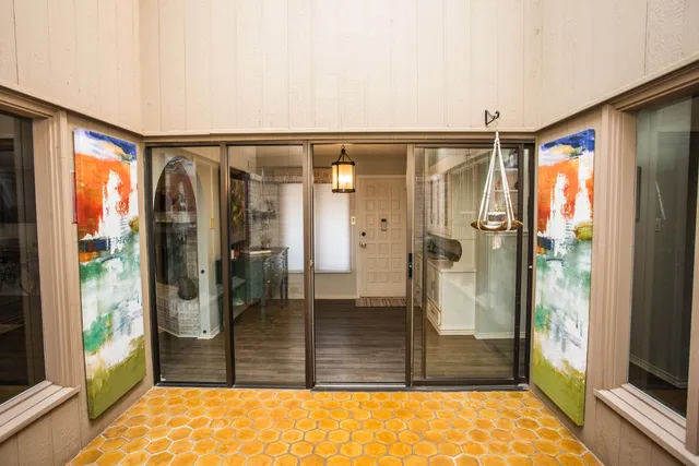 a bathroom with a shower and a toilet