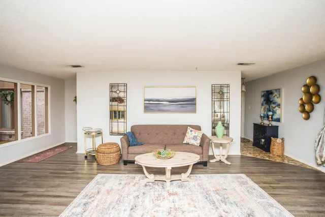 a view of a hallway with a dining area