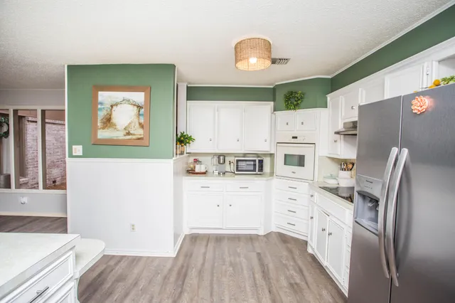 a bathroom with a shower and a sink