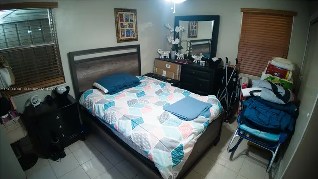 a living room with furniture and flowers