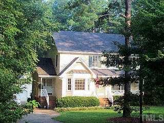 10713 Marthas Way Raleigh, NC 27615 - Photo 1 of 1 a front view of a house with a garden