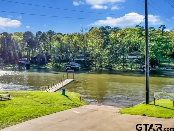 a view of a lake with a yard