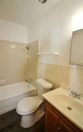 a bathroom with a toilet sink and bathtub