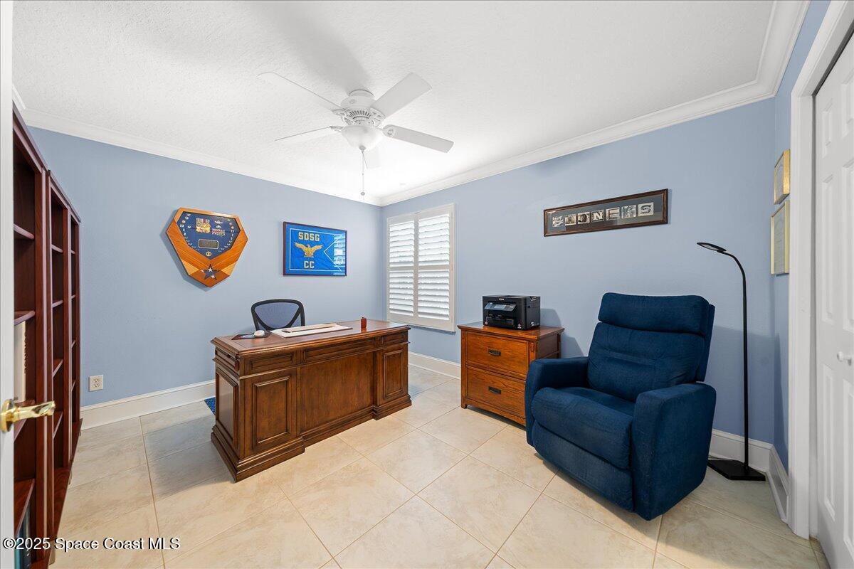 171 Seaview Street Melbourne Beach, FL 32951 - Photo 22 of 44 a living room with furniture and a window