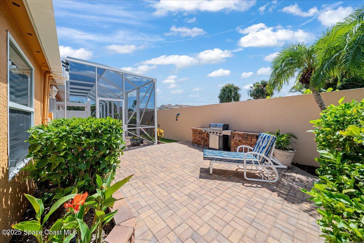 171 Seaview Street Melbourne Beach, FL 32951 - Photo 35 of 44 a roof deck with table and chairs and potted plants