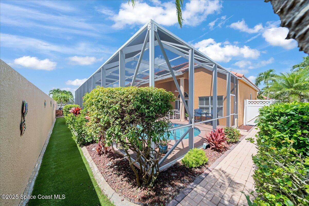 171 Seaview Street Melbourne Beach, FL 32951 - Photo 36 of 44 a view of a house with a yard