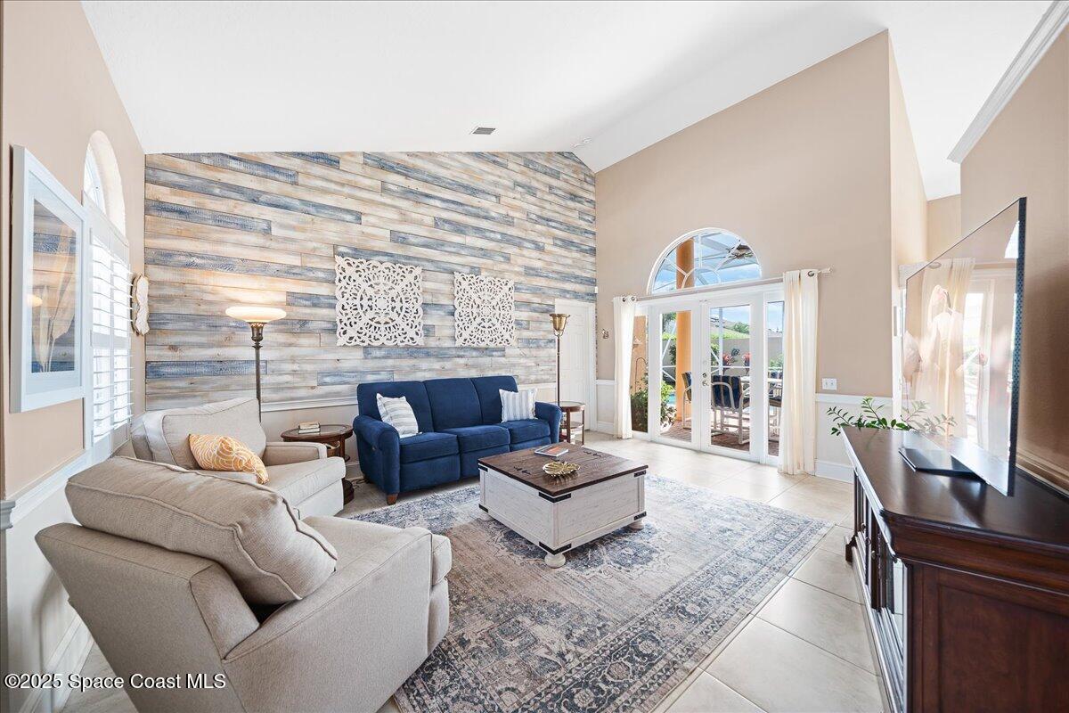 171 Seaview Street Melbourne Beach, FL 32951 - Photo 6 of 44 a living room with furniture wooden floor and a fireplace