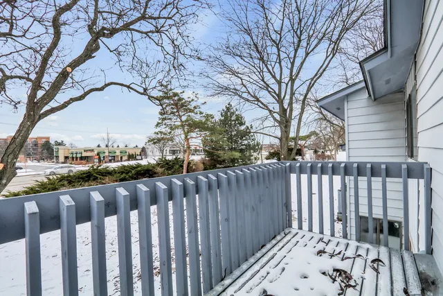 a view of wooden fence and trees around