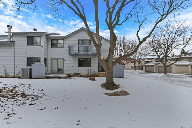 a view of a house with a snow in front of it