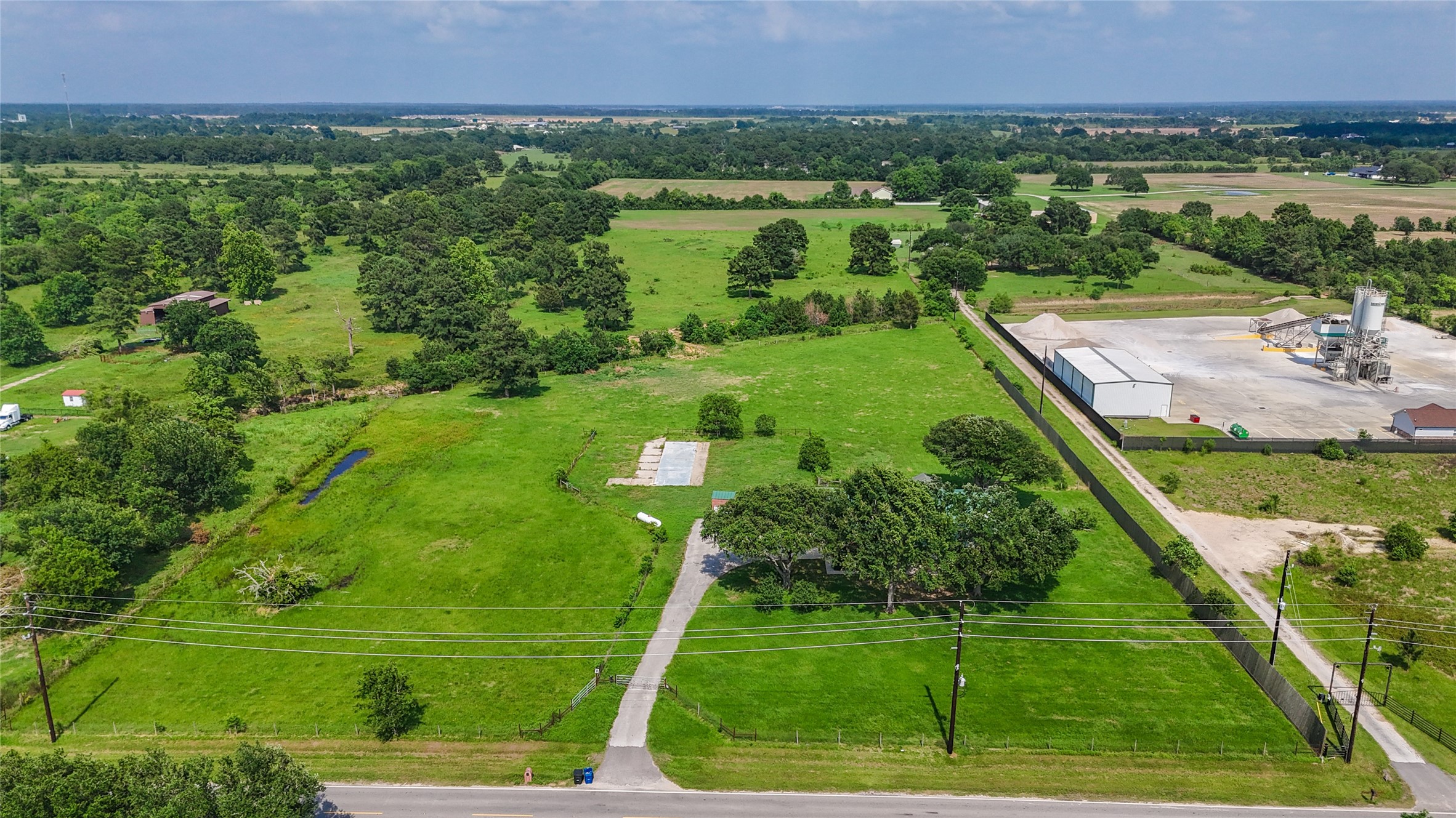 19250 Becker Road Hockley, TX 77447 - Photo 11 of 38 a view of a city with lush green forest