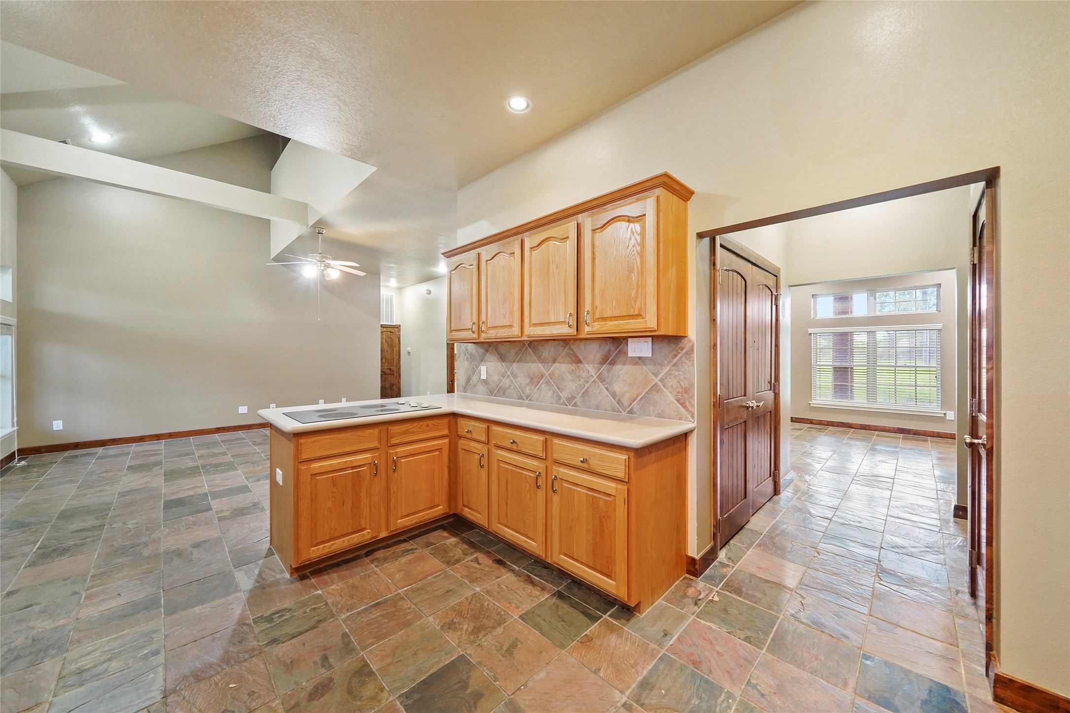 19250 Becker Road Hockley, TX 77447 - Photo 24 of 38 a kitchen with stainless steel appliances granite countertop a sink and a refrigerator