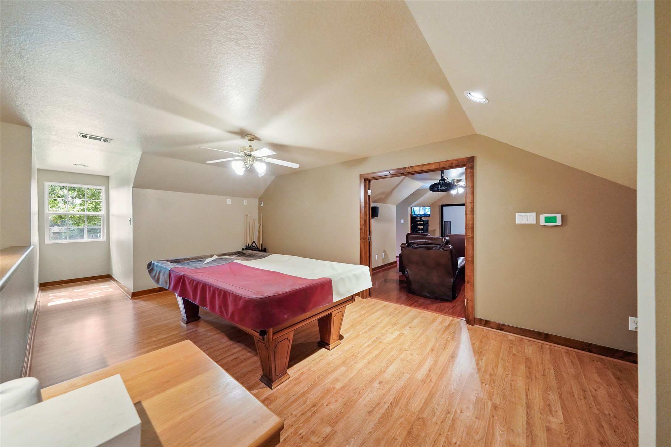 19250 Becker Road Hockley, TX 77447 - Photo 30 of 38 a bedroom with a bed and wooden floor