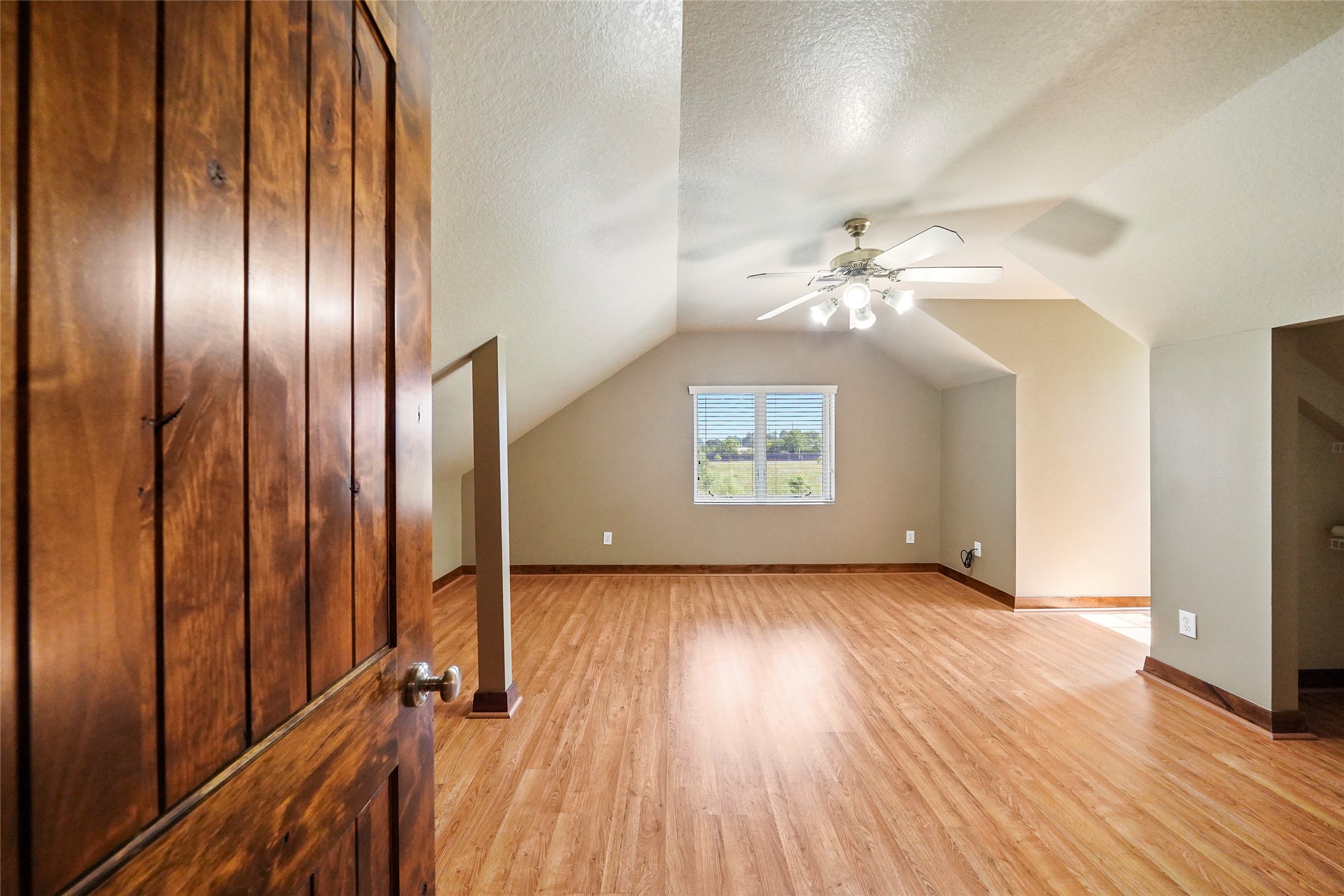 19250 Becker Road Hockley, TX 77447 - Photo 34 of 38 an empty room with wooden floor mirror and windows