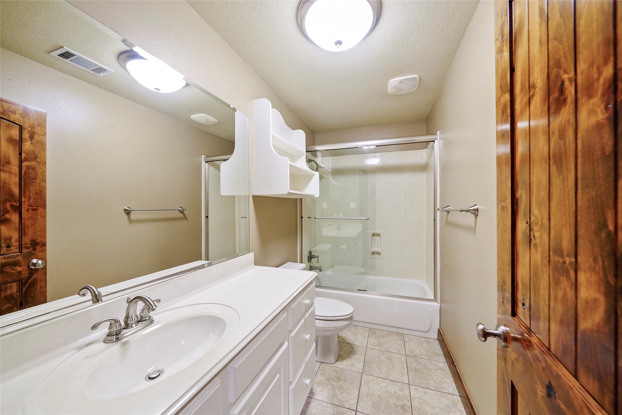 19250 Becker Road Hockley, TX 77447 - Photo 35 of 38 a bathroom with a sink a toilet and shower