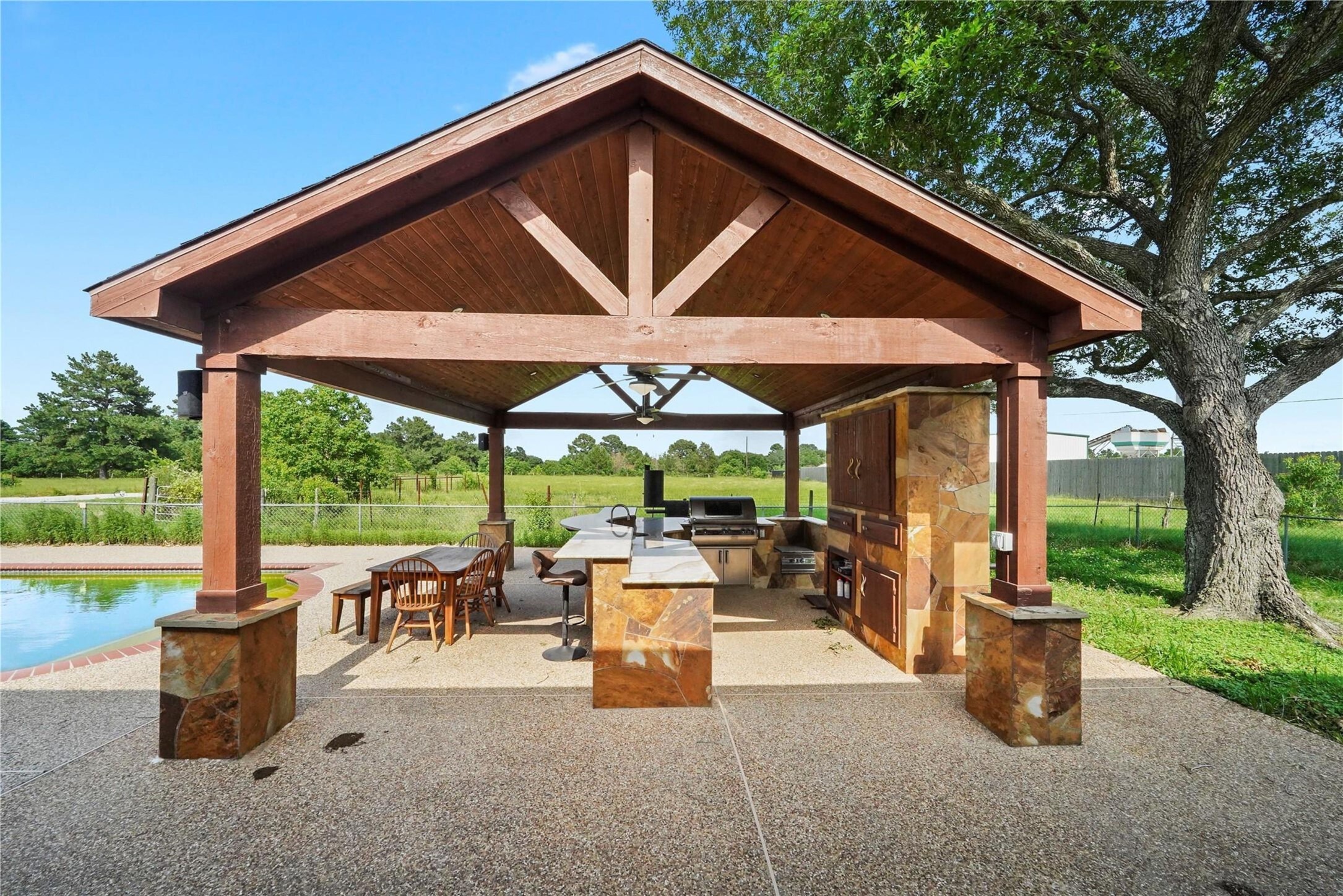 19250 Becker Road Hockley, TX 77447 - Photo 37 of 38 a patio with a table and chairs