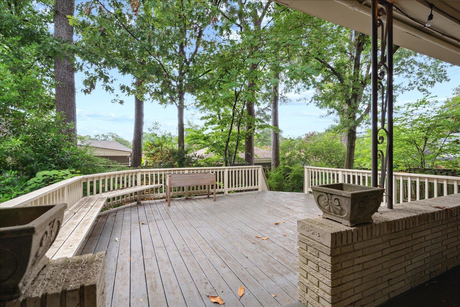 5517 Normandy Road Memphis, TN 38120 - Photo 21 of 24 a view of a deck with a table and chair with wooden floor and fence