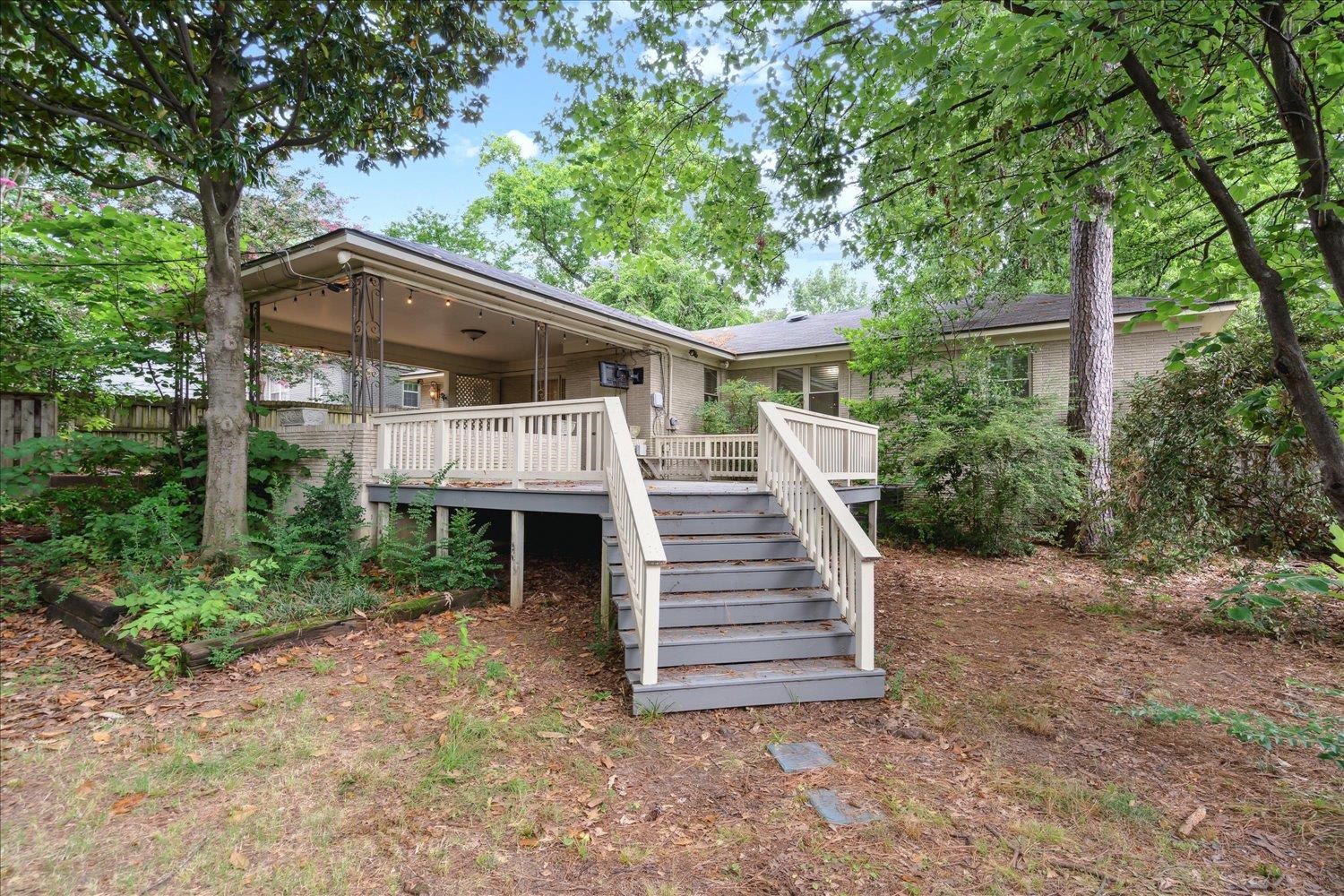 5517 Normandy Road Memphis, TN 38120 - Photo 23 of 24 a view of a house with a yard and large trees