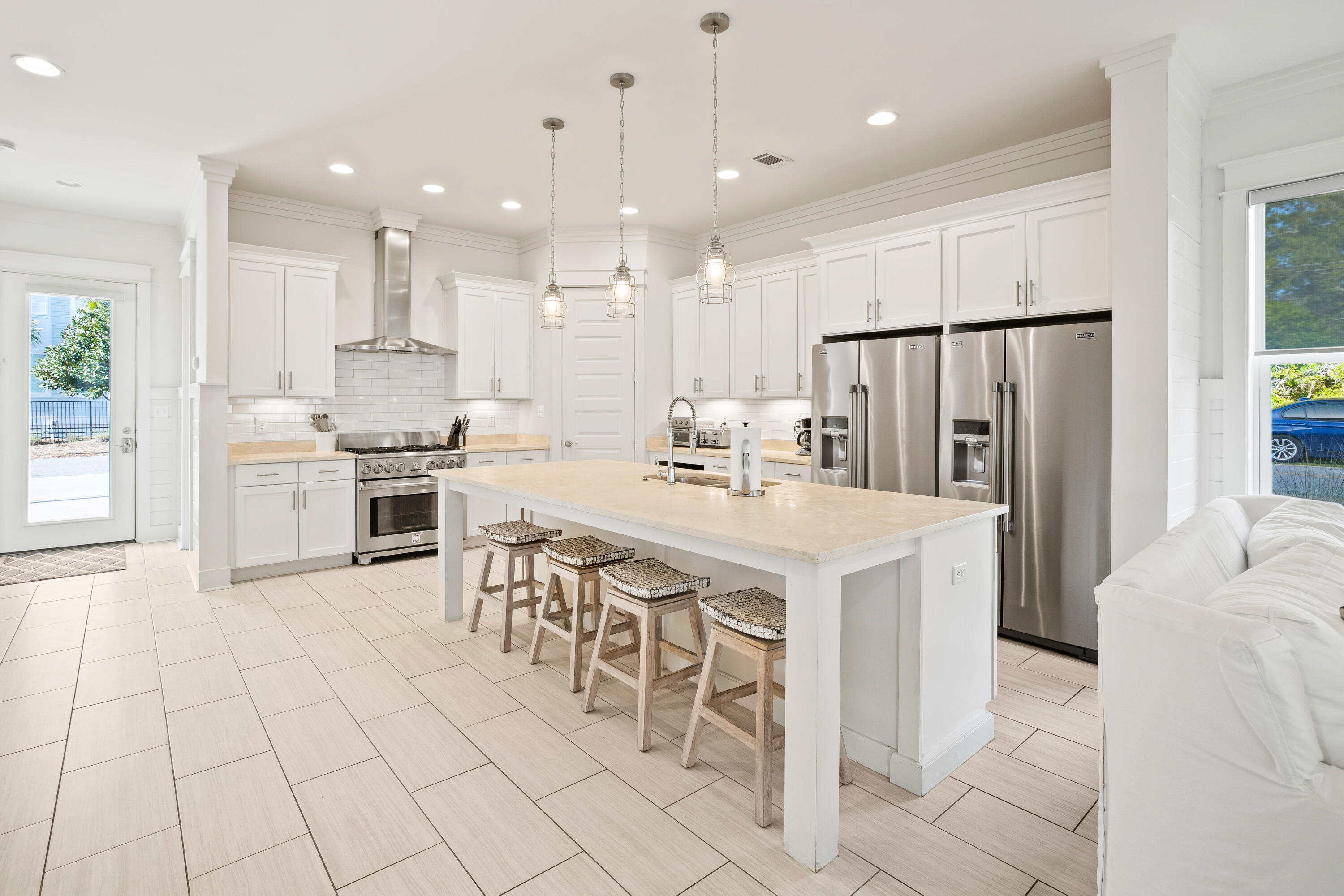 114 South Wall Street Inlet Beach, FL 32461 - Photo 11 of 62 a kitchen with stainless steel appliances kitchen island granite countertop a refrigerator and a stove top oven