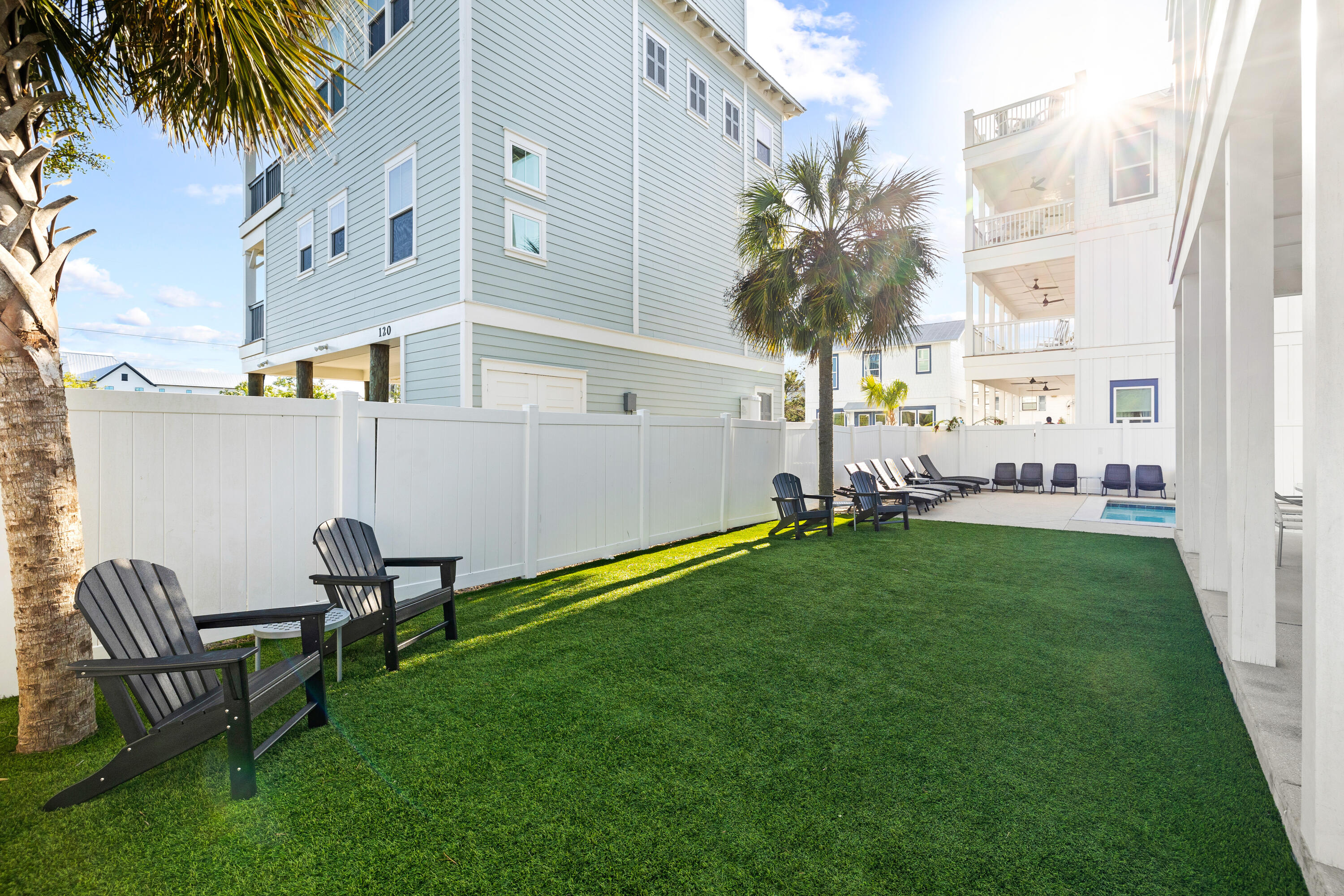 114 South Wall Street Inlet Beach, FL 32461 - Photo 25 of 62 a view of a chair and table in backyard
