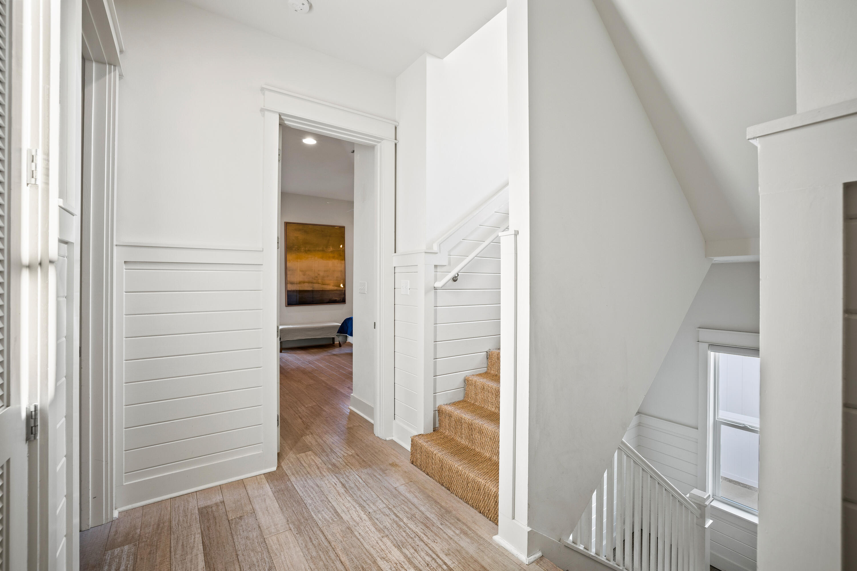 114 South Wall Street Inlet Beach, FL 32461 - Photo 32 of 62 a view of a hallway with wooden floor and staircase