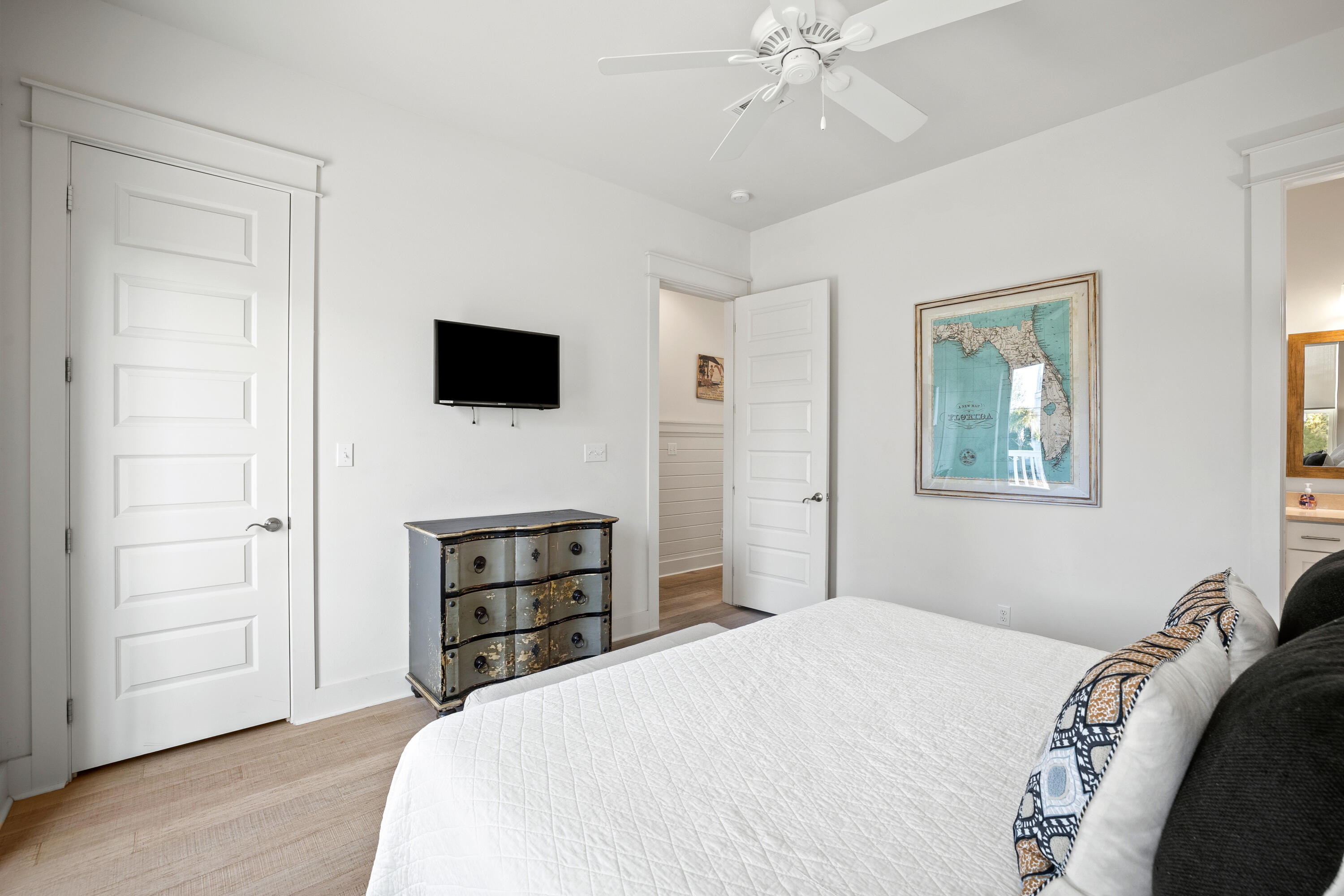 114 South Wall Street Inlet Beach, FL 32461 - Photo 34 of 62 a bedroom with a bed and a flat tv screen on a dresser